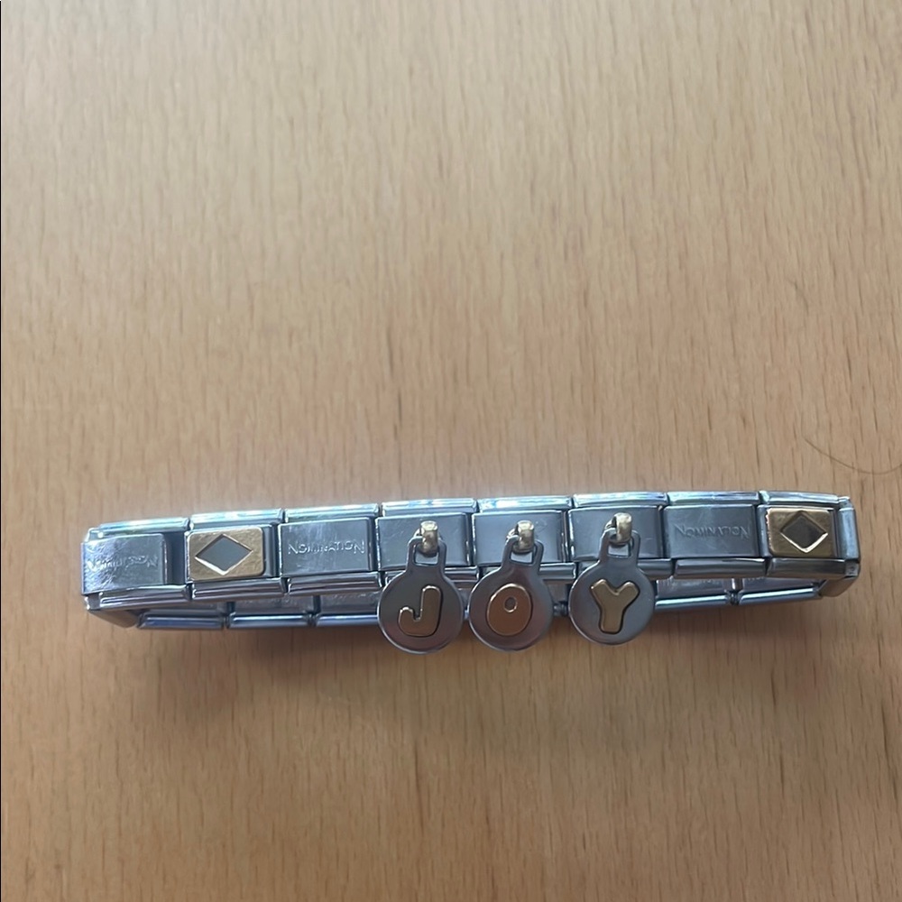NOMINATION stainless steel with gold bracelet.